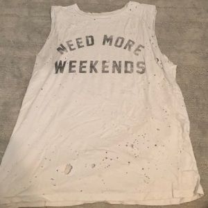 White tank top with rips all over.